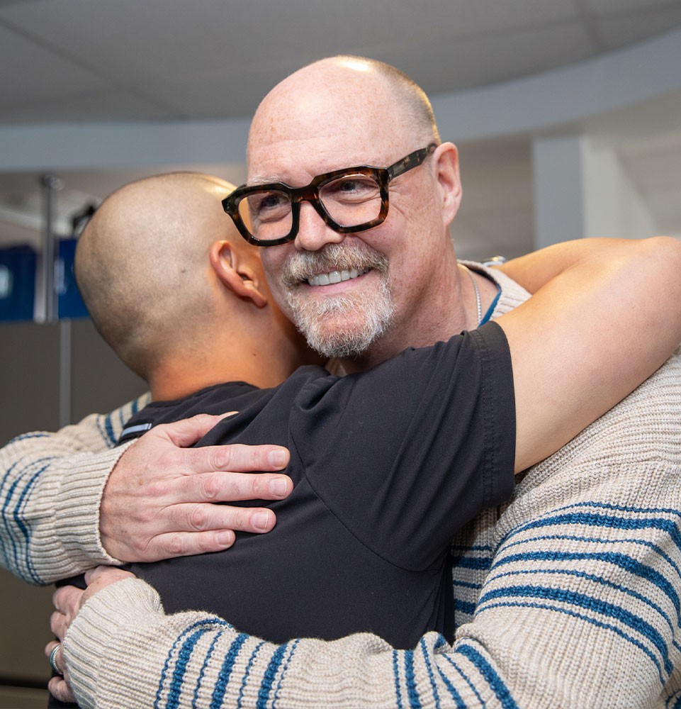 Patient and staff member after patient's dental procedure